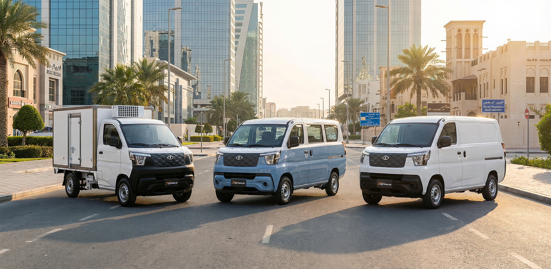Three CMC vans lined up on a Bahrain city street at sunrise